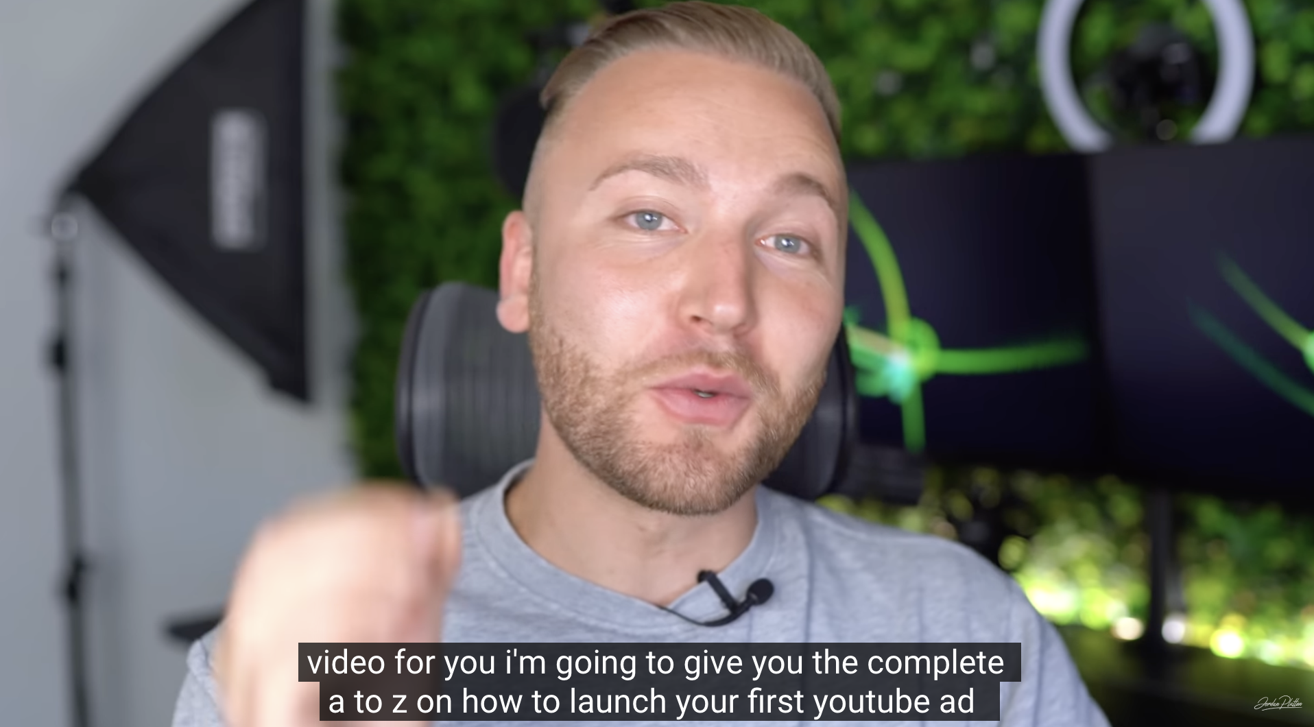 screenshot from a youtube video about youtube ads tutorial with a guy wearing a grey top