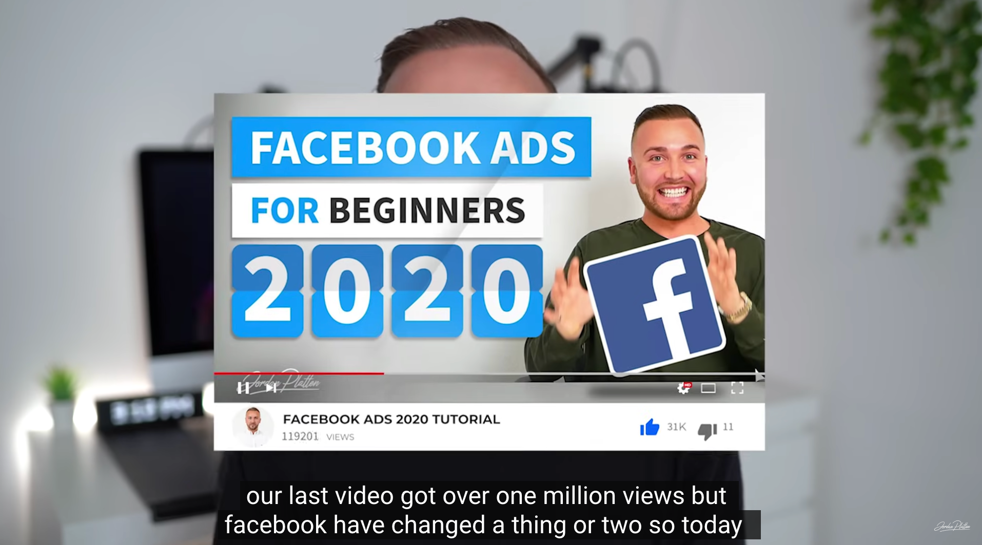 screenshot from a youtube video with a guy wearing a black top talking about facebook ads for beginners